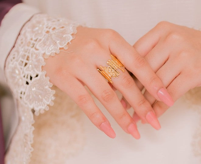 Pair of golden whisper cuff and golden abstract ring